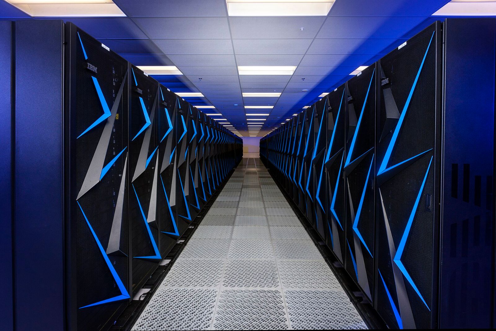 Rows of supercomputer racks in a high-performance computing data hall